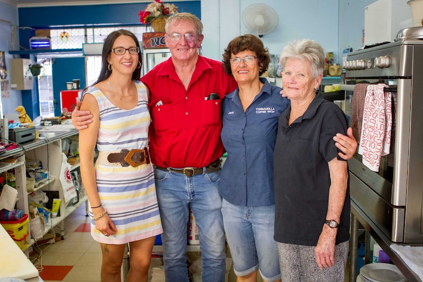 Rebecca King and her family in the kitchen of their cafe.