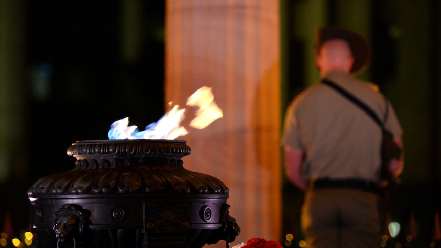 The eternal flame burns during the Anzac Day dawn service at the Cenotaph in Brisbane.