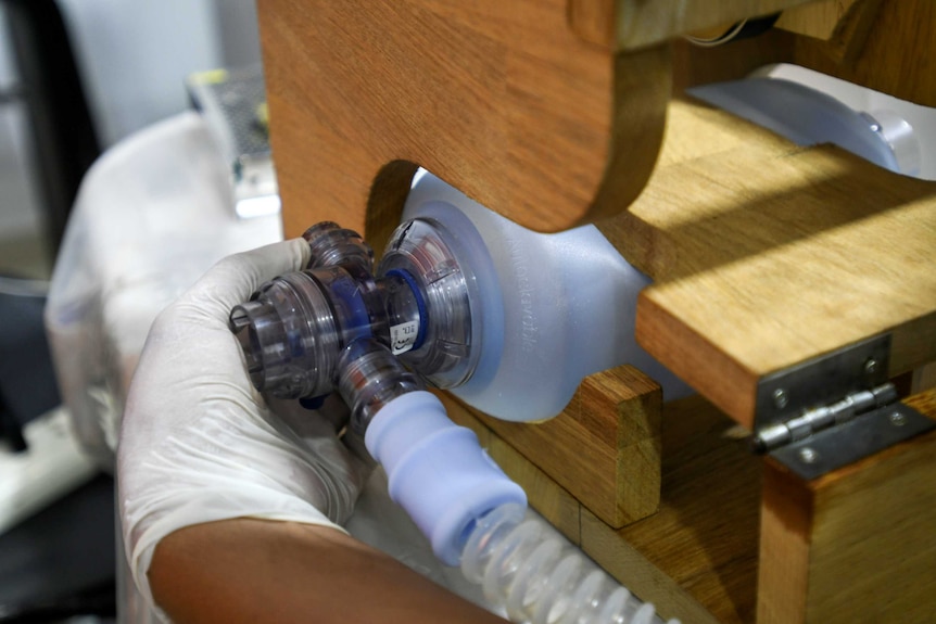 A volunteer works on a ventilator for use during the coronavirus disease (COVID-19) outbreak, in Santa Cruz, Bolivia.