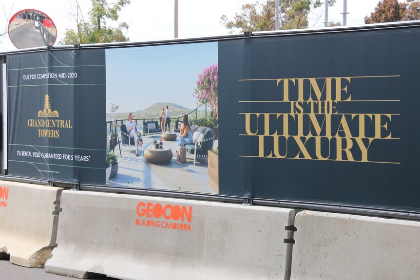 Advertising around the construction site for Geocon's Grand Central Towers.