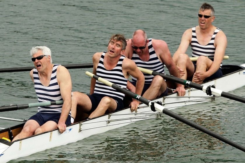 Competitors show signs of exhaustion in the men's rowing
