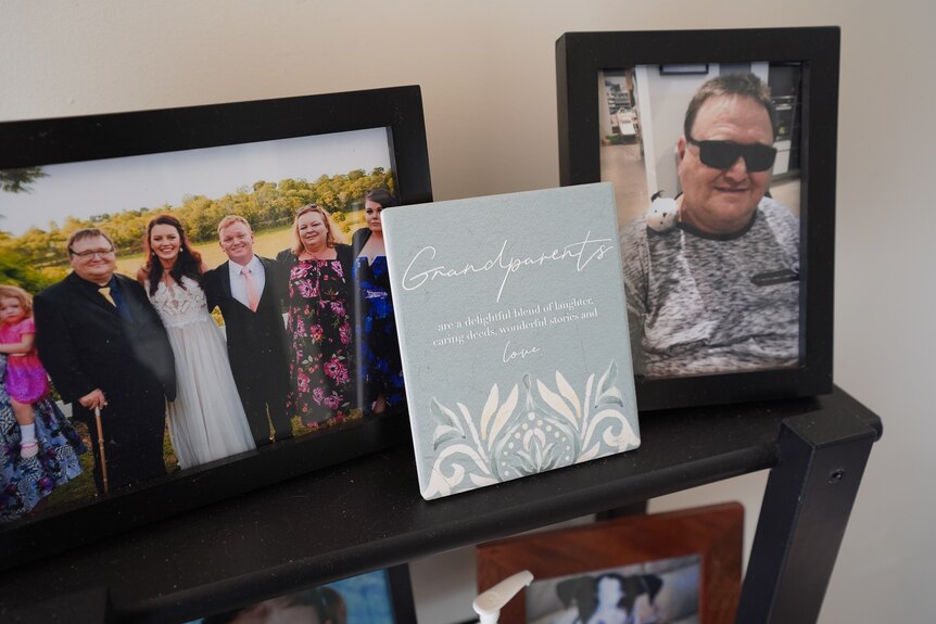 Picture frames with photos of a man and his family