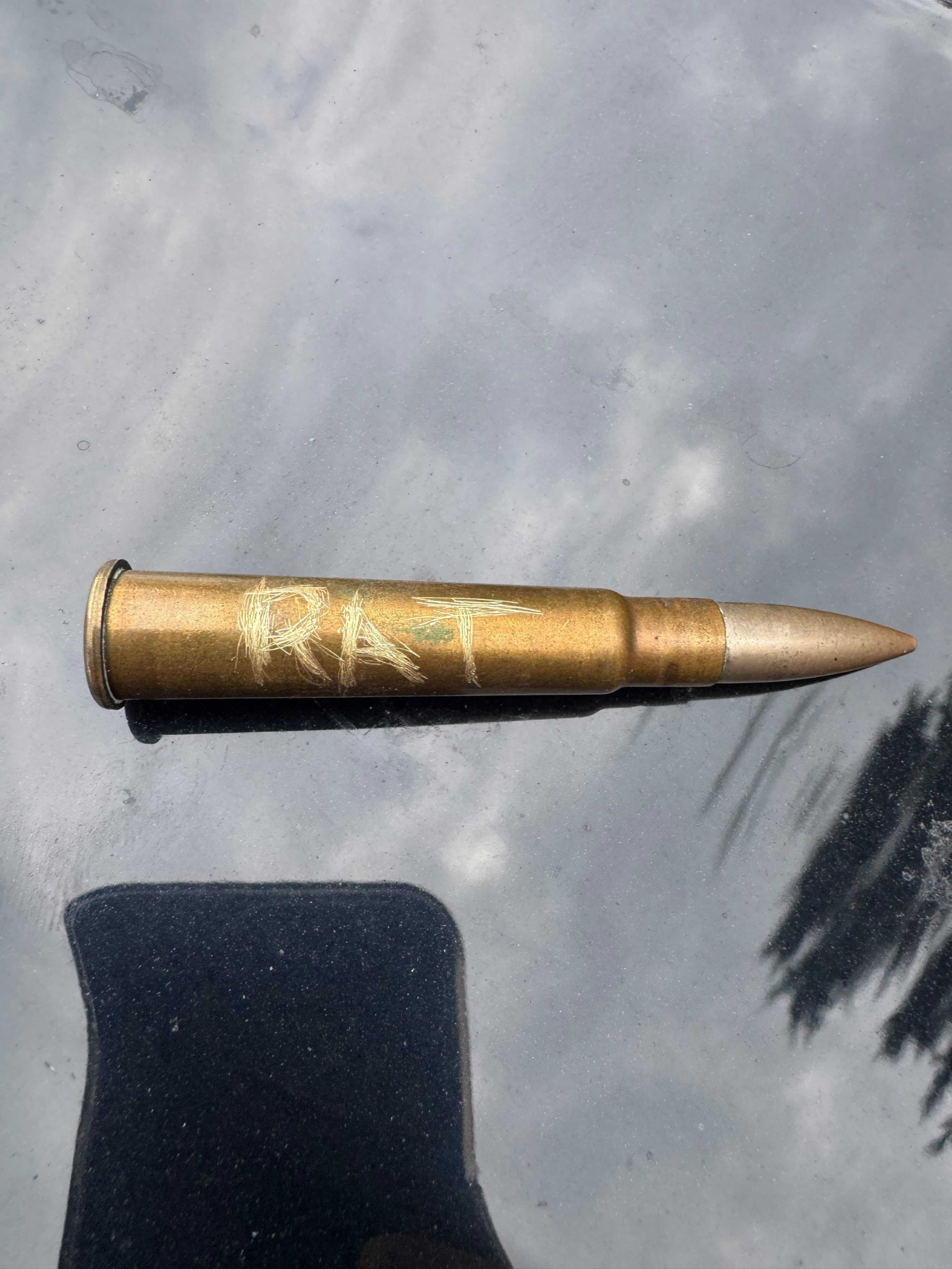 Police investigate bullet inscribed with 'RAT' found on Victorian MP's car