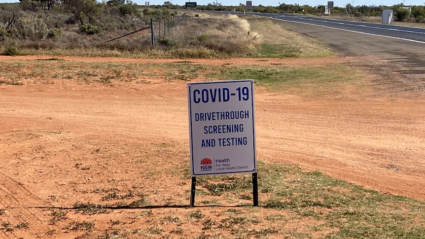 COVID-19 testing sign on a dirt road in Wilcannia