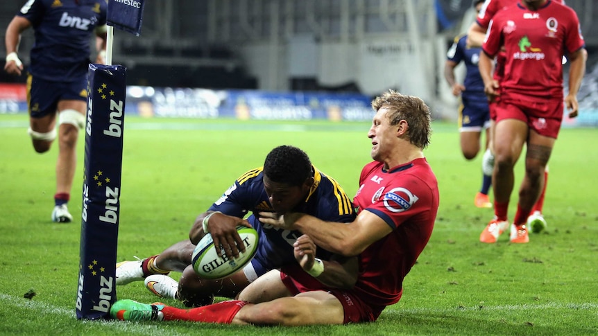 Waisake Naholo of the Highlanders touches down for a try