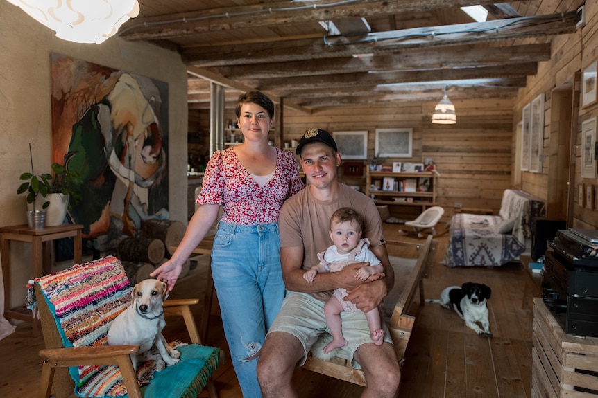 Eva and Aljaž with their baby daughter Varja, accompanied by their two dogs, Jun and Jaki.