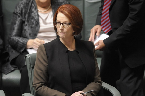 Prime Minister Julia Gillard listens during Question Time.