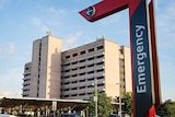 A photograph of Royal Darwin Hospital, with a large 'Emergency' arrow pointing to the main entrance.