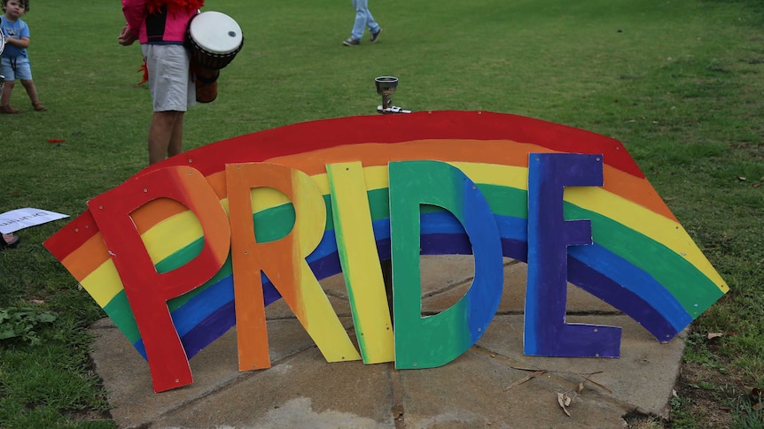 A rainbow sign for the gay pride march in Dubbo.