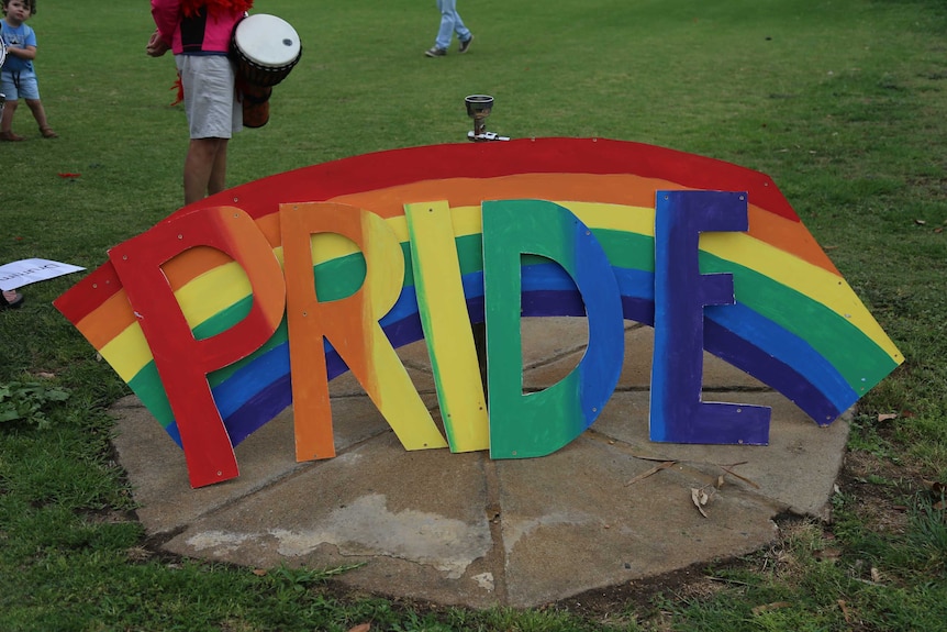 A rainbow sign for the gay pride march in Dubbo.