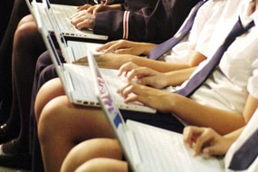 File photo: Students with laptops (AAP: Alan Porritt)