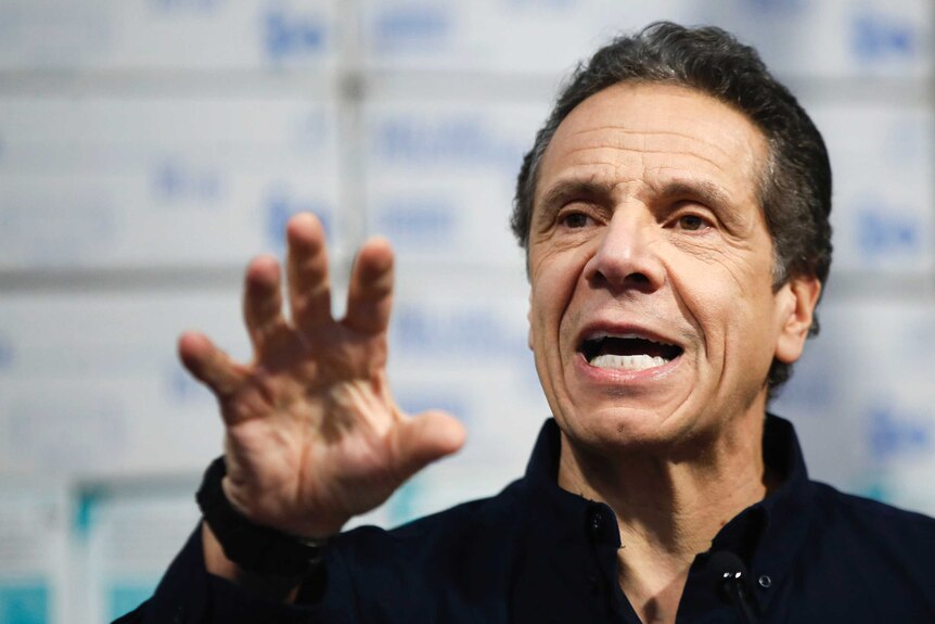 New York Governor Andrew Cuomo gestures with his hand while speaking