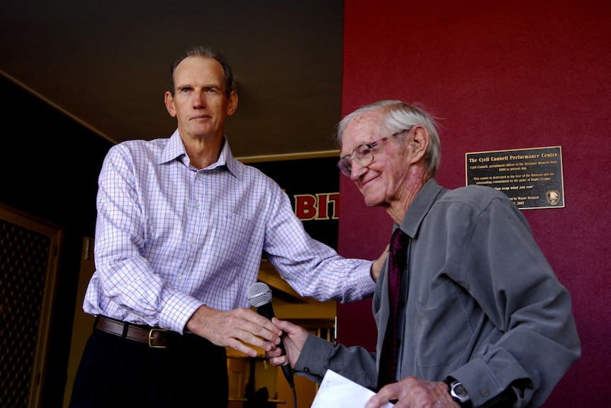 Wayne Bennett shakes hands with Cyril Connell at the opening of the Cyril Connell High Performance Centre.