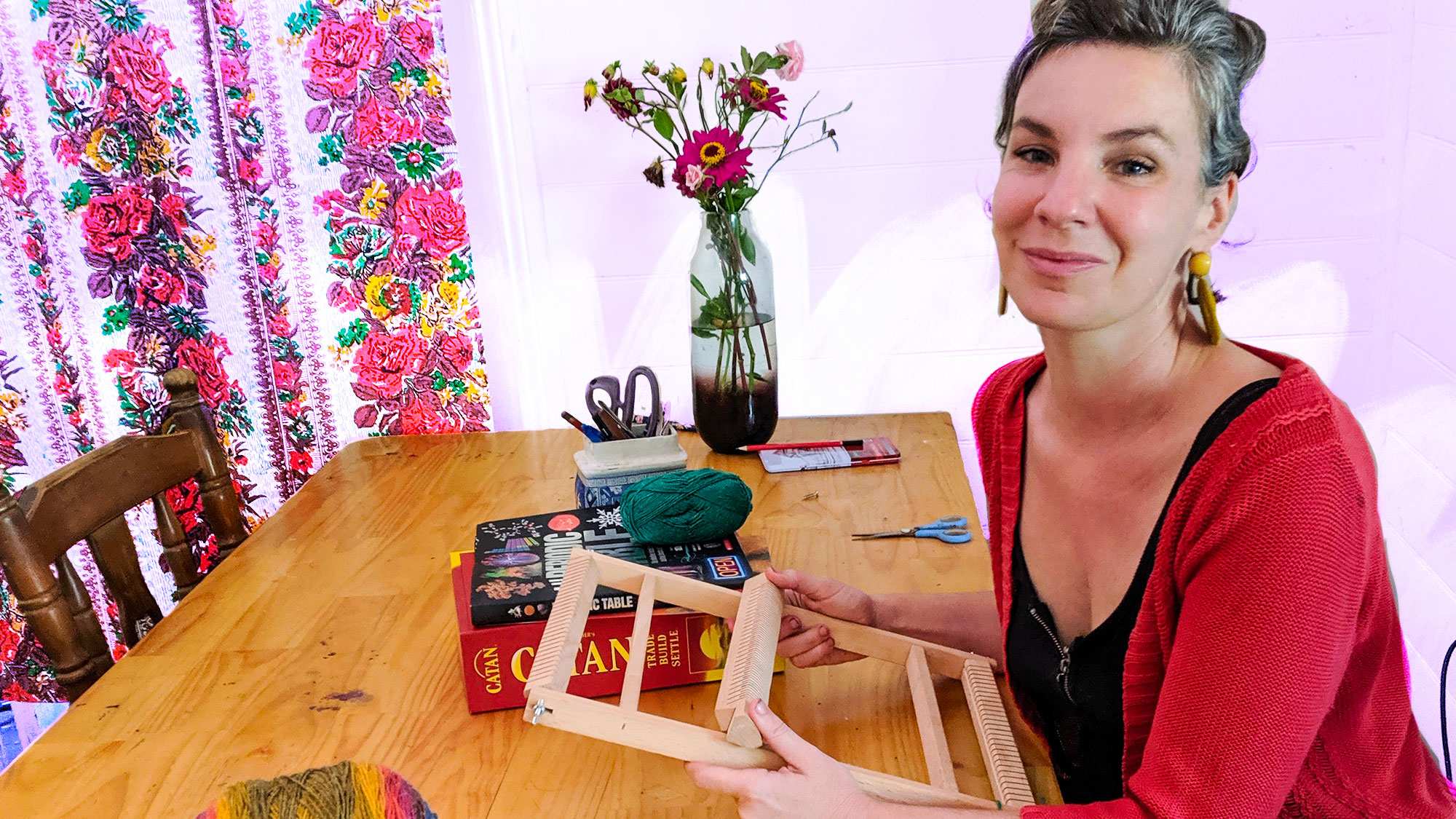 Woman sitting at table with loom pictured in story about how to control online shopping during coronavirus pandemic.