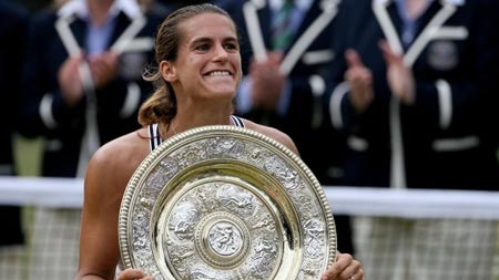 Amelie Mauresmo celebrates with the Wimbledon trophy.