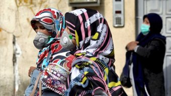 People where masks to help guard against the coronavirus in downtown Tehran, Iran.