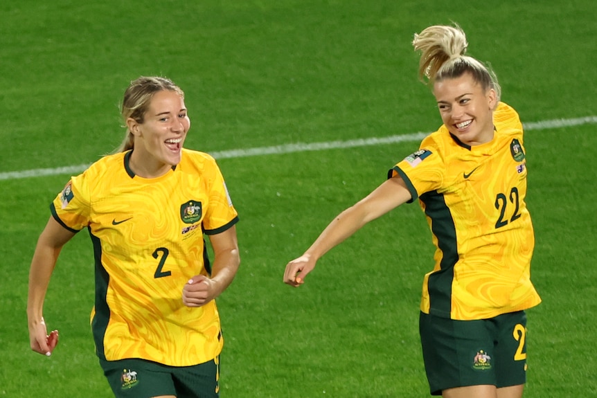 Courtney Nevin and Charlotte Grant warm up for the Matildas before the Denmark Women's World Cup game.