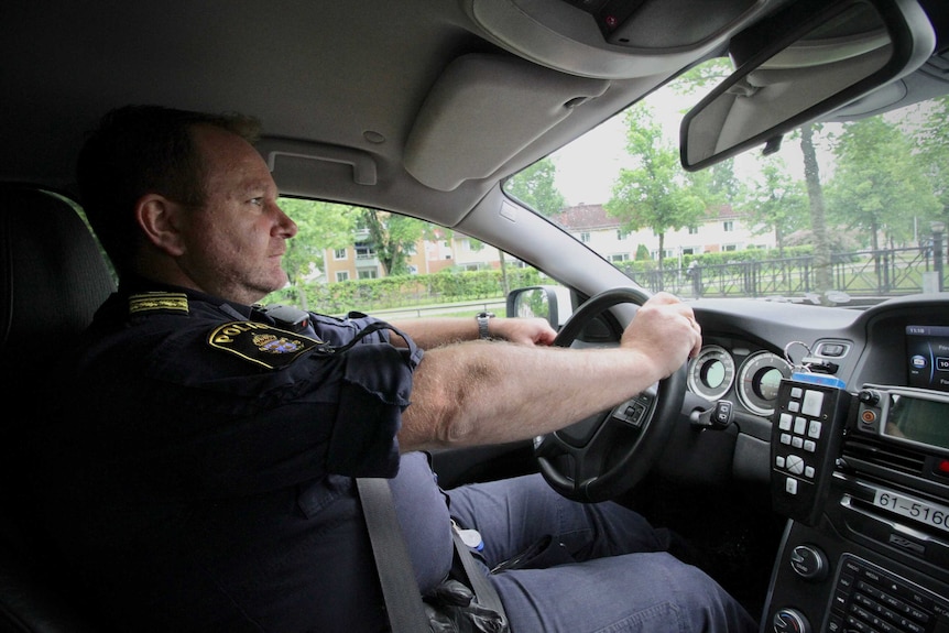 Scott Goodwin in his police car