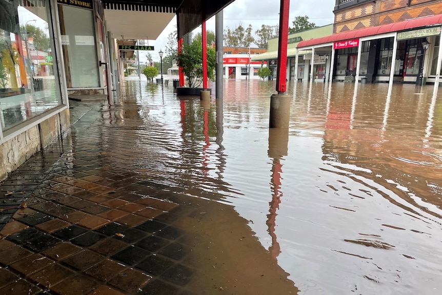 Floodwaters swamp shops in main street of Laidley.