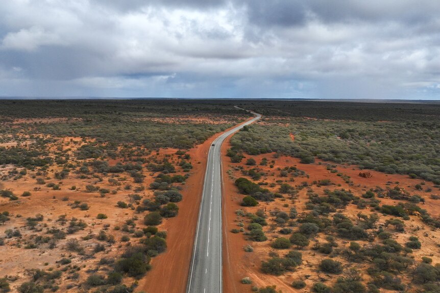 An aerial shot of an outback road.