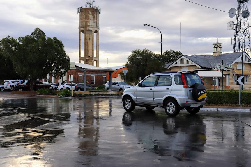 The streets of a country town, wet after a month's worth of rain in one night.