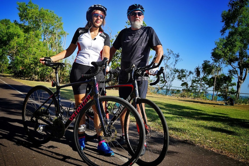 Michael and Lidia di Lembo stand with their bicycles.