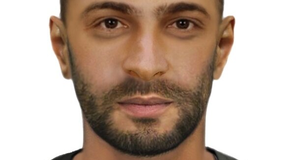 A computer generated image of a man's face with short dark hair and facial hair.