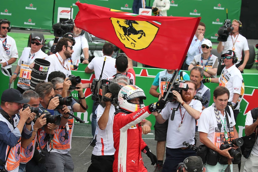 Ferrari's Sebastian Vettel celebrates winning the Canadian F1 Grand Prix in Montreal.