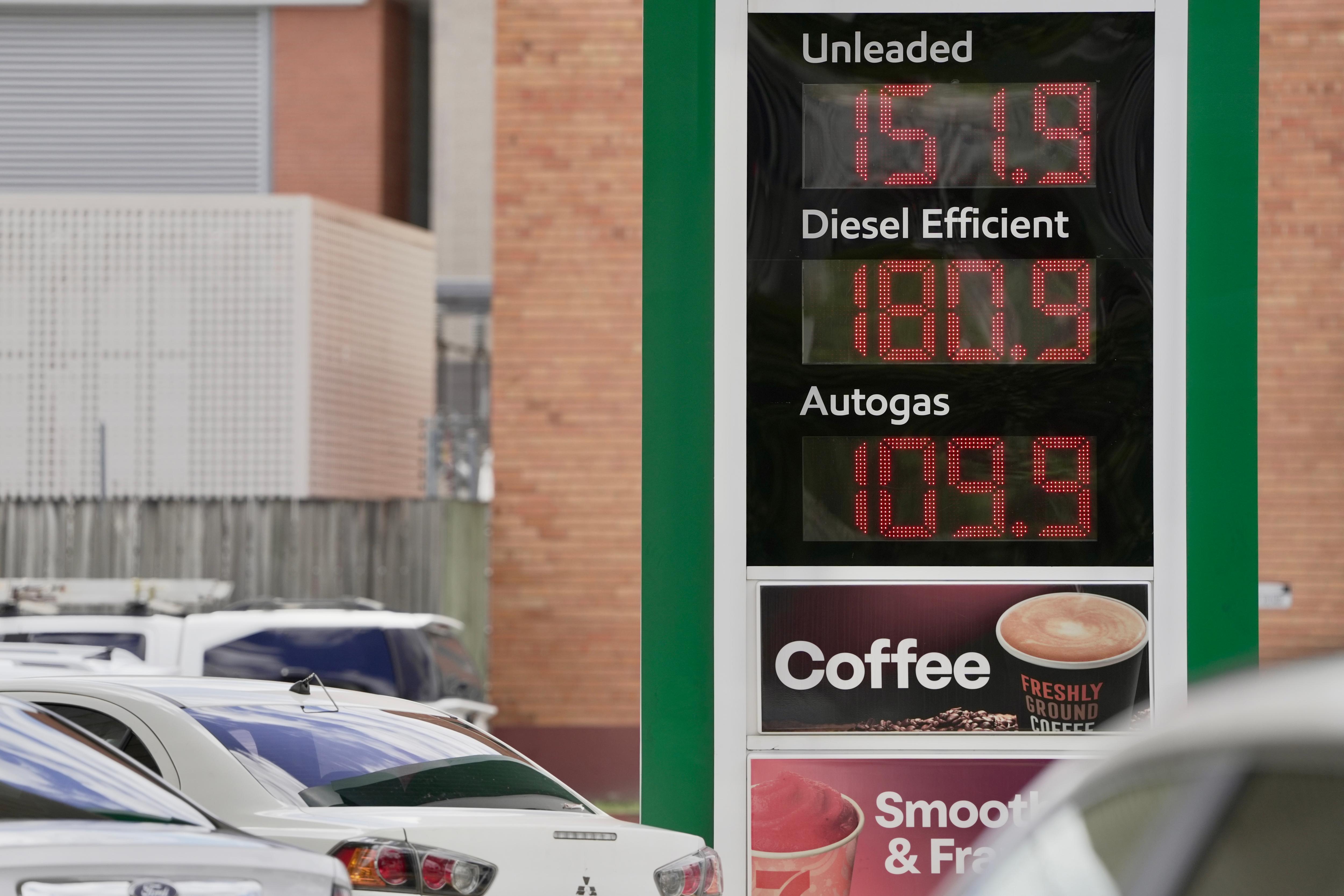 What is driving petrol prices down in Brisbane?