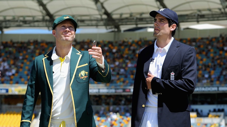 Michael Clarke tosses the coin with Alastair Cook ahead of the first Test