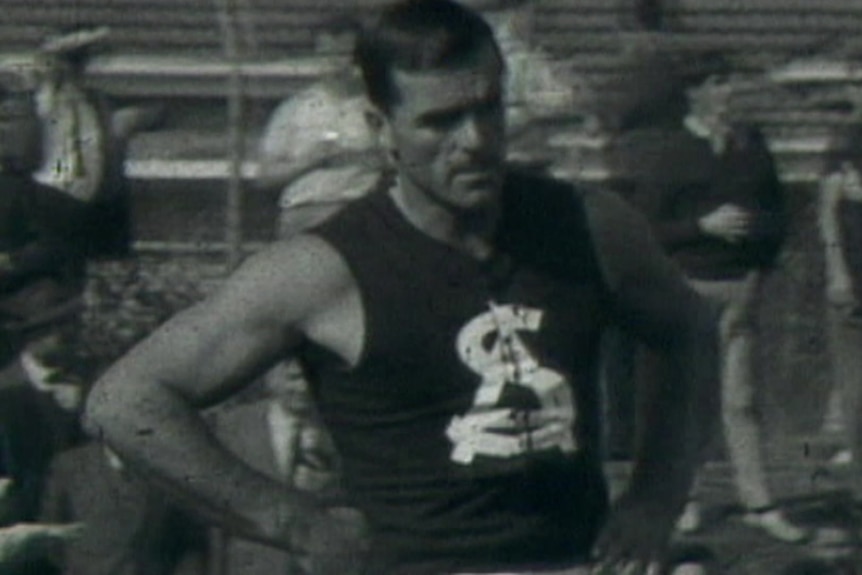 A football player wearing a black jumper