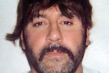 Convicted drug trafficker Tony Mokbel in disguise with a toupee and moustache.