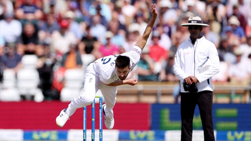 England bowler Mark Wood leaves the ground as he bowls during an Ashes Test.