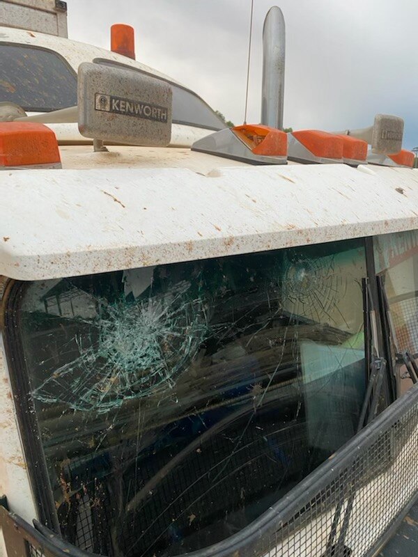 smashed windscreen on a truck from a rock impact