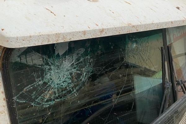 smashed windscreen on a truck from a rock impact