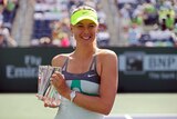 Maria Sharapova poses with the Indian Wells Masters title after beating Caroline Wozniacki.