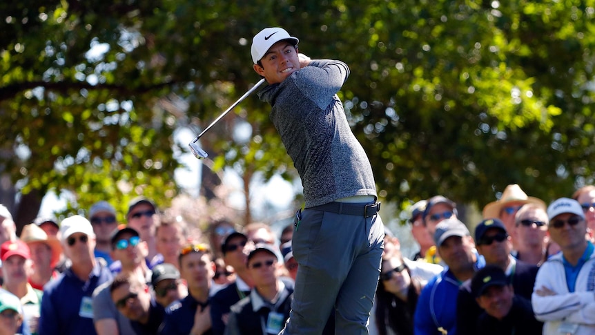 Rory McIlroy plays his shot from the fourth tee.