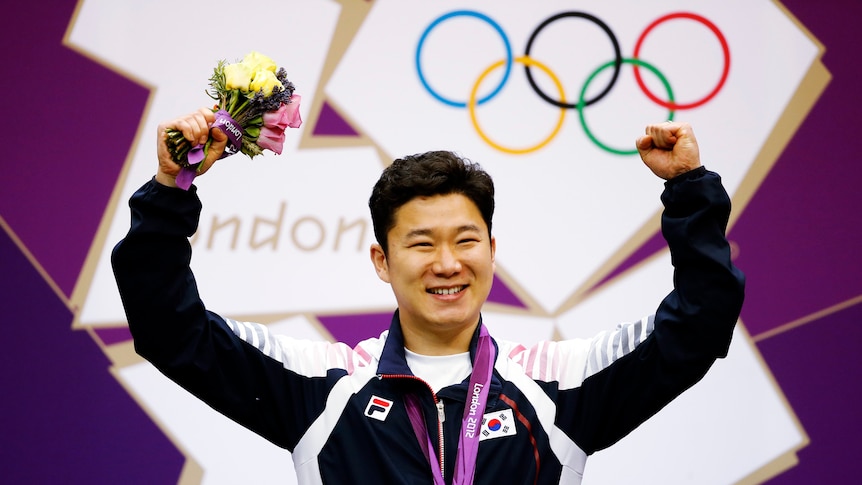Sharp shooter ... South Korea's Jin Jong-oh celebrates 50m pistol gold.