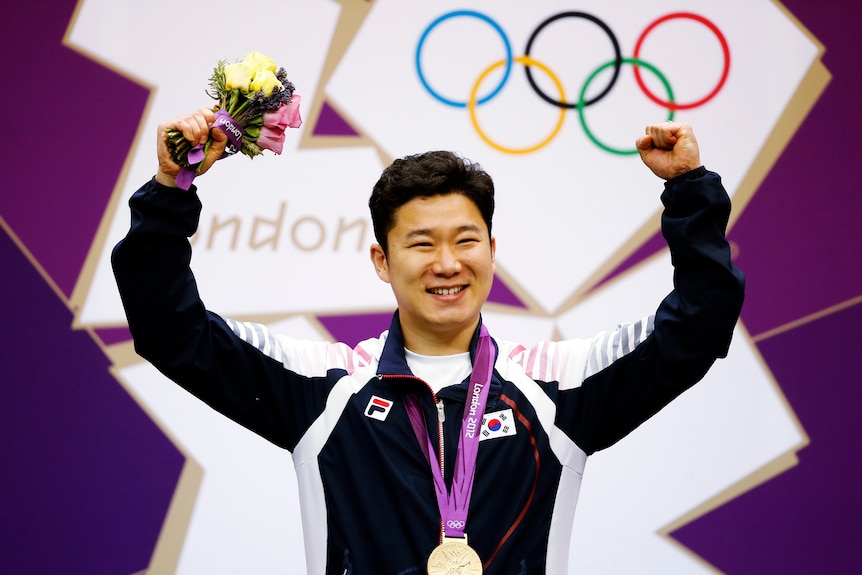 Sharp shooter ... South Korea's Jin Jong-oh celebrates 50m pistol gold.