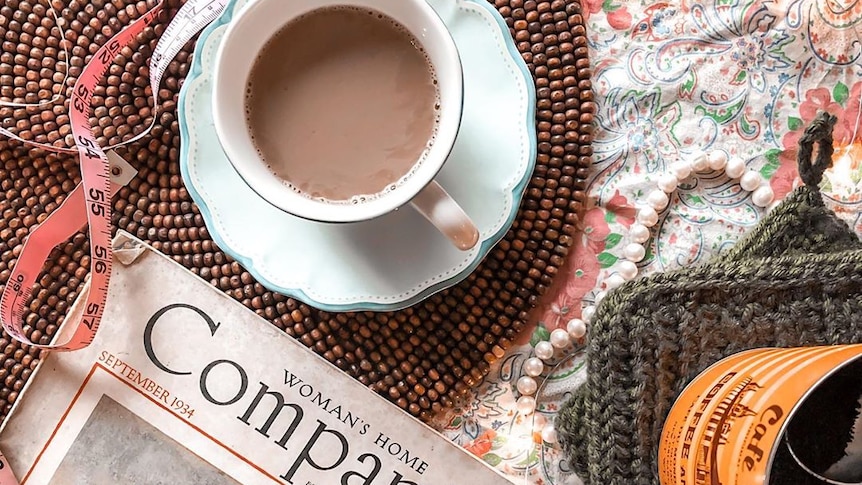 A cup of tea, measuring tape and a copy of Woman's Home Companion sits on Danielle's coffee table.