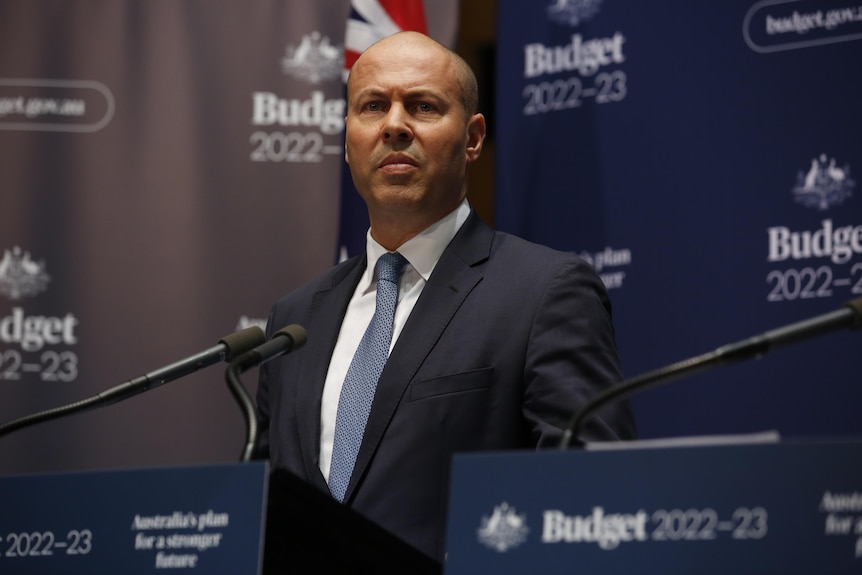 Josh Frydenberg stands in front of Budget 2022-23 branding