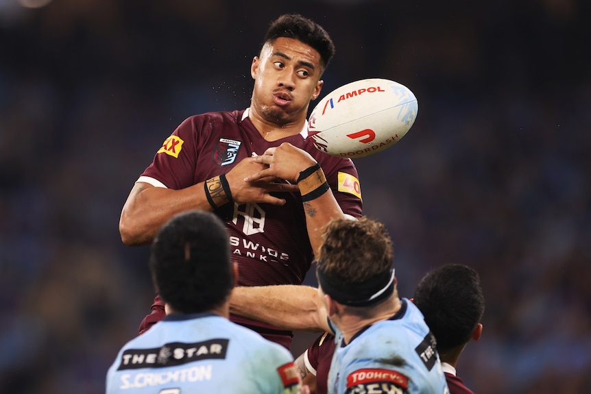 Murray Taulagi drops a ball and looks to one side