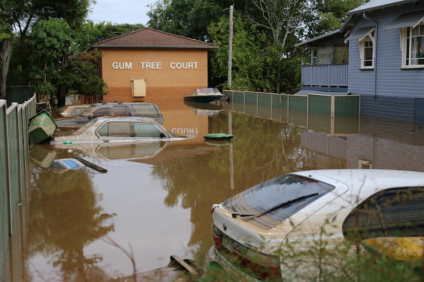 Cars under flood water at Gum Tree Court, Lismore