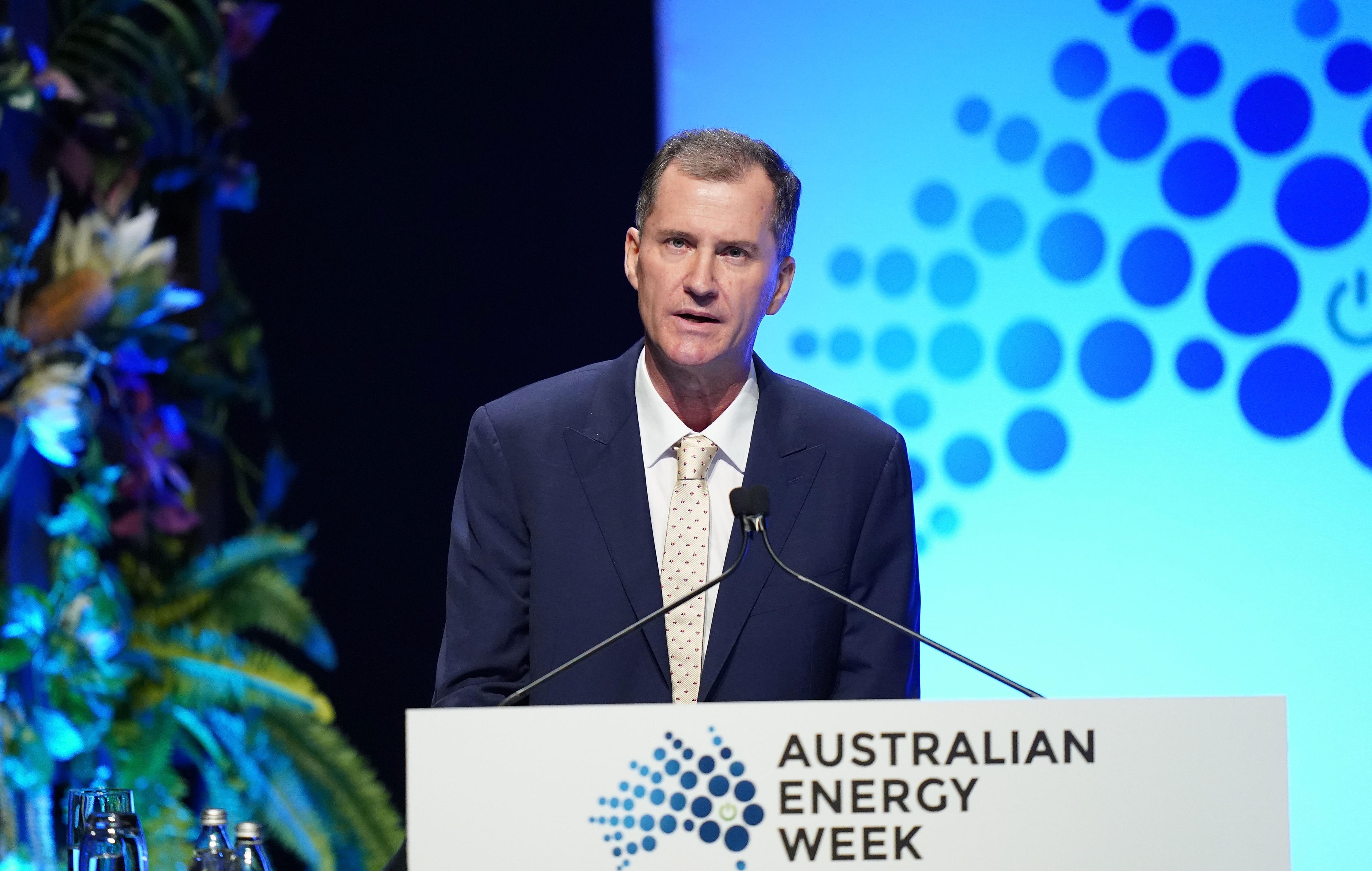 Justin Oliver speaks on the podium