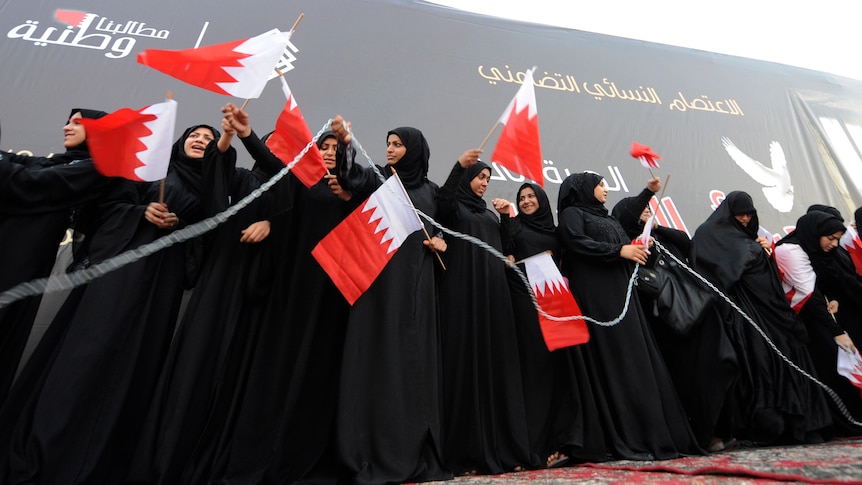 Shiite protesters chain themselves during a women's anti-government demonstration in Bahrain