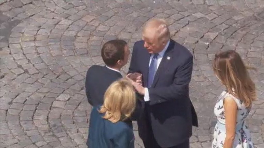 A long handshake between Trump and Macron ends US President's first official visit to France