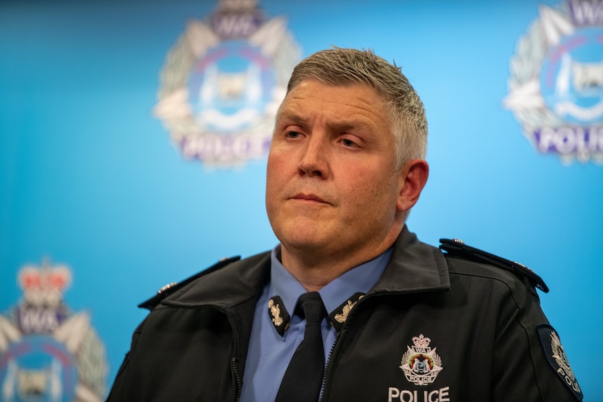 WA Police commissioner Col Blanch wears a uniform and speaks in front of a police background. 