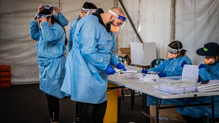 healthcare workers wearing protective clothing