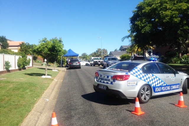 Police in Remick Street at Stafford Heights on Brisbane's northside, where a woman in her 60s has died