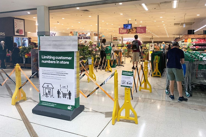 Queue barrier set up at Woolworths supermarket at Westfield Garden City shopping centre in Brisbane.